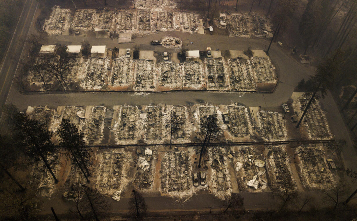 FILE - Residences leveled by a wildfire in Paradise, Calif., are seen on Nov. 15, 2018. State Farm will discontinue coverage for 72,000 houses and apartments in California starting summer 2024, the insurance giant said. The Illinois-based company, California&rsquo;s largest insurer, cited soaring costs, the increasing risk of catastrophes like wildfires and outdated regulations as reasons it won&rsquo;t renew the policies on 30,000 houses and 42,000 apartments, the Bay Area News Group reported Thursday, March 21, 2024.