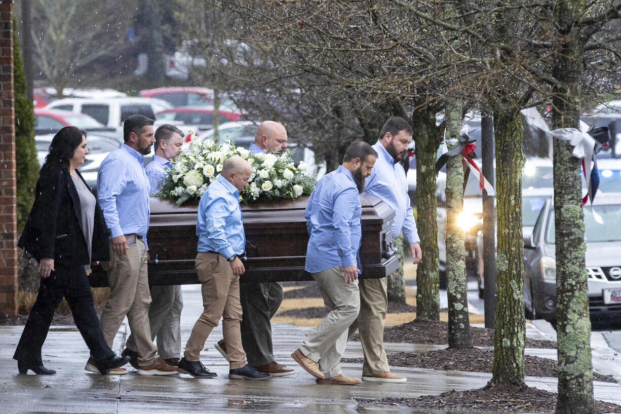 The casket of Laken Riley, the 22-year-old nursing student who was killed last week on the University of Georgia campus, is brought to a hearse following her funeral at Woodstock City Church in Woodstock, Ga., on Friday, March 1, 2024.