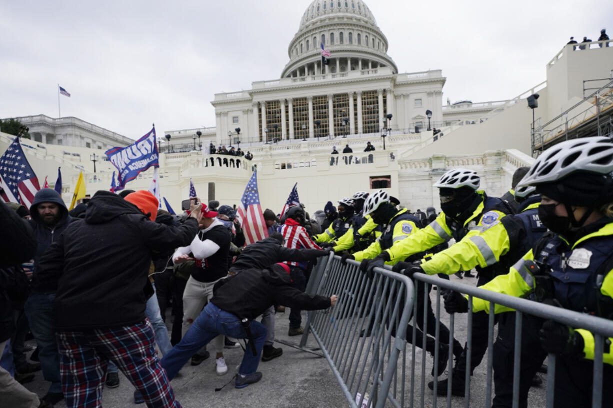 FILE - Rioters loyal to President Donald Trump push against a line of police at the U.S. Capitol in Washington on Jan. 6, 2021. House Republicans are aiming to undercut the Jan. 6 Committee&rsquo;s investigation with a new report that they say contradicts some of key testimony given to the panel.