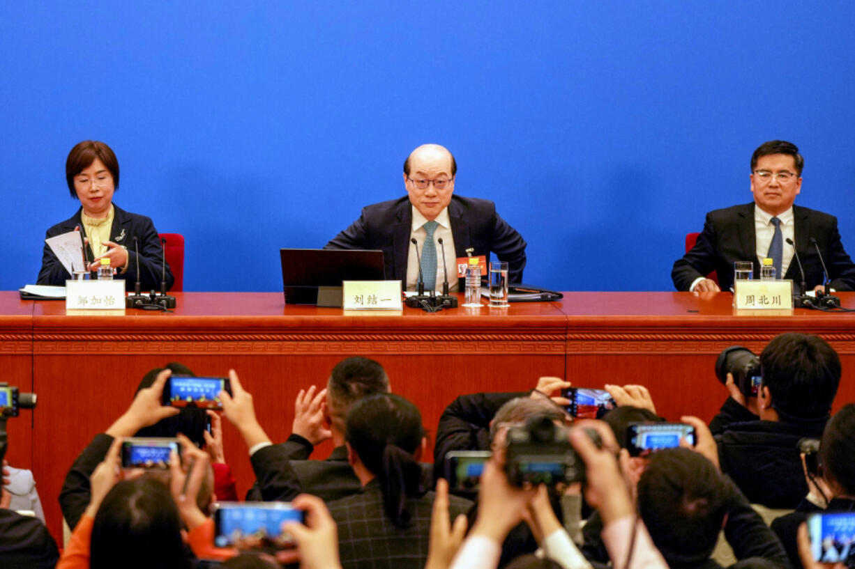 Liu Jieyi, center, spokesperson for the Chinese People&#039;s Political Consultative Conference, or CPPCC,  attends a press conference ahead of the annual congress in Beijing, Sunday, March 3, 2024. The CPPCC is an advisory body to the National People&#039;s Congress which opens Tuesday.