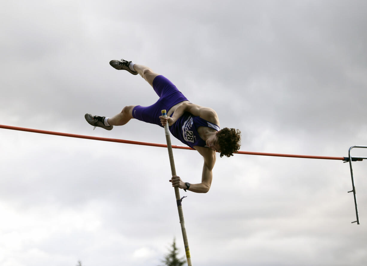 Eli Wenger of Columbia River clears the bar in the boys pole vault  in a 2A Greater St. Helens League track and field meet at Columbia River High School on Tuesday, March 26, 2024.