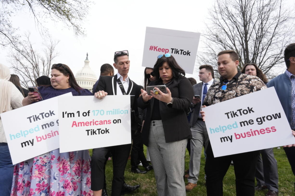 Devotees of TikTok gather at the Capitol in Washington, as the House passed a bill that would lead to a nationwide ban of the popular video app if its China-based owner doesn&rsquo;t sell, Wednesday, March 13, 2024. Lawmakers contend the app&rsquo;s owner, ByteDance, is beholden to the Chinese government, which could demand access to the data of TikTok&rsquo;s consumers in the U.S. (AP Photo/J.
