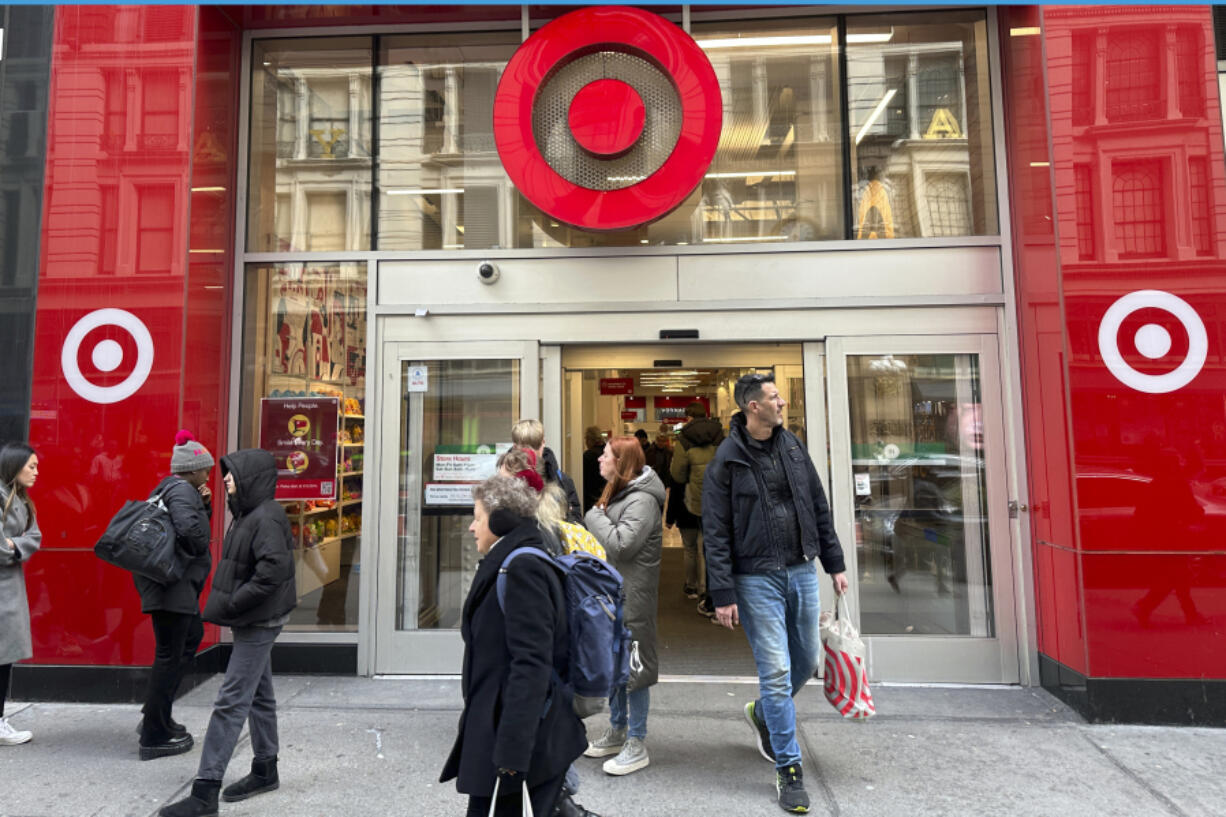 Shoppers walk from a Target store in midtown Manhattan in New York on Tuesday, March 19, 2024. On Tuesday, March 26, 2024, the Conference Board issues its latest monthly report on U.S. consumer confidence, which captures public responses on issues ranging from purchasing plans to the direction of inflation.