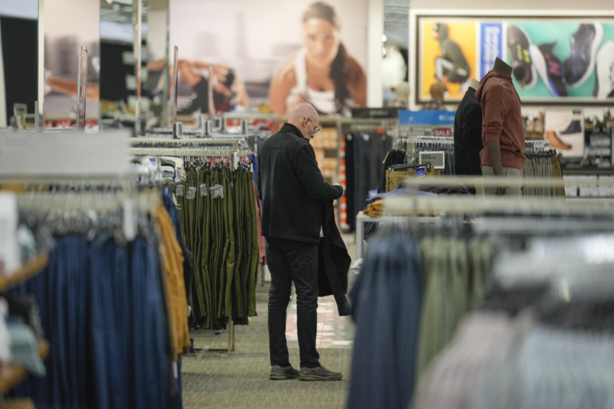 FILE - A shopper looks at clothing displayed at a Kohl&rsquo;s in Clifton, N.J., Jan. 26, 2024. On Tuesday, March 12, 2024, the Labor Department issues its report on inflation at the consumer level in February.