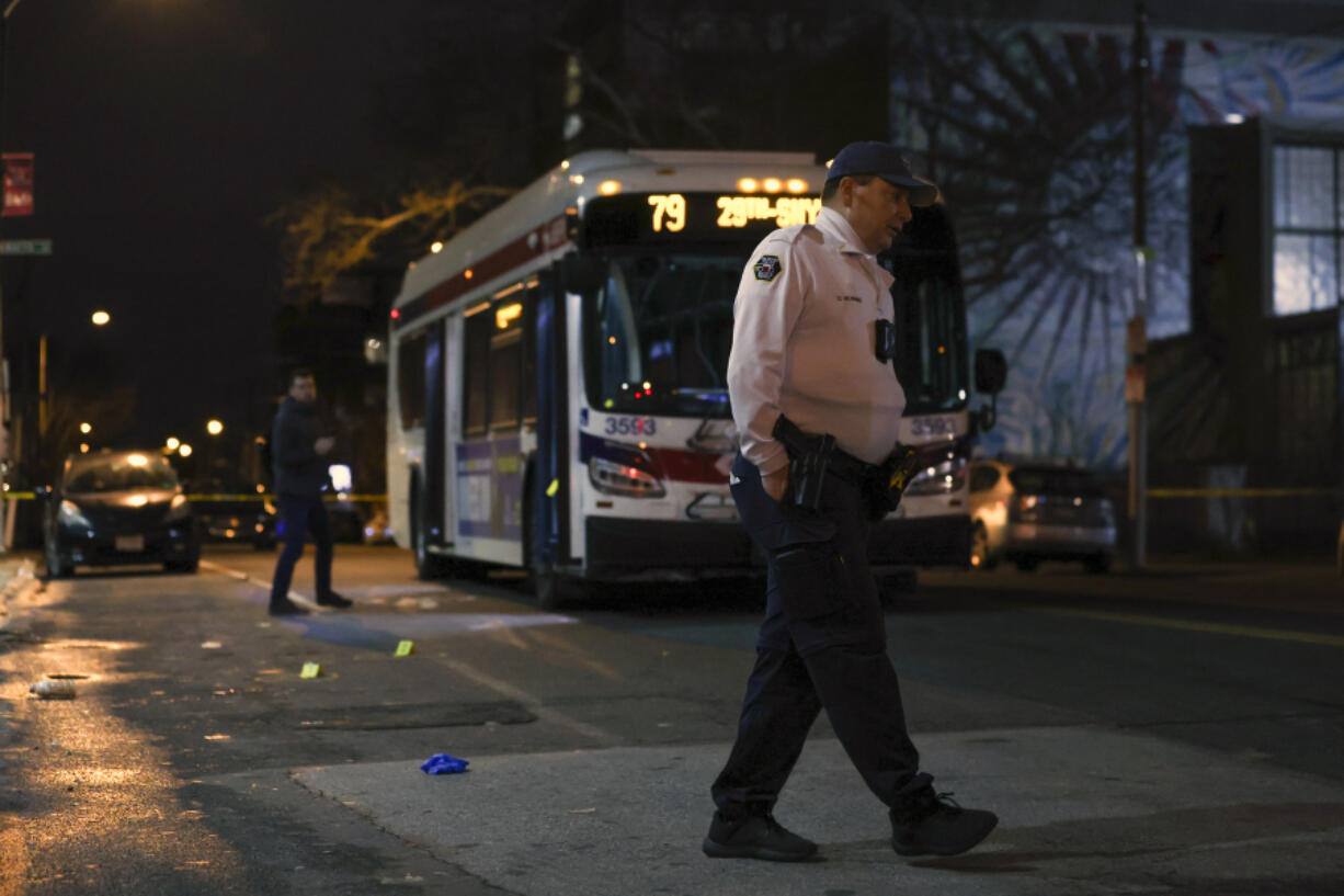 Police respond to a deadly shooting on a SEPTA bus in South Philadelphia on Tuesday, March 5, 2024. A passenger shot aboard the bus  has died from his wounds, marking the third time in three days that someone was killed while riding, entering or leaving a SEPTA bus.