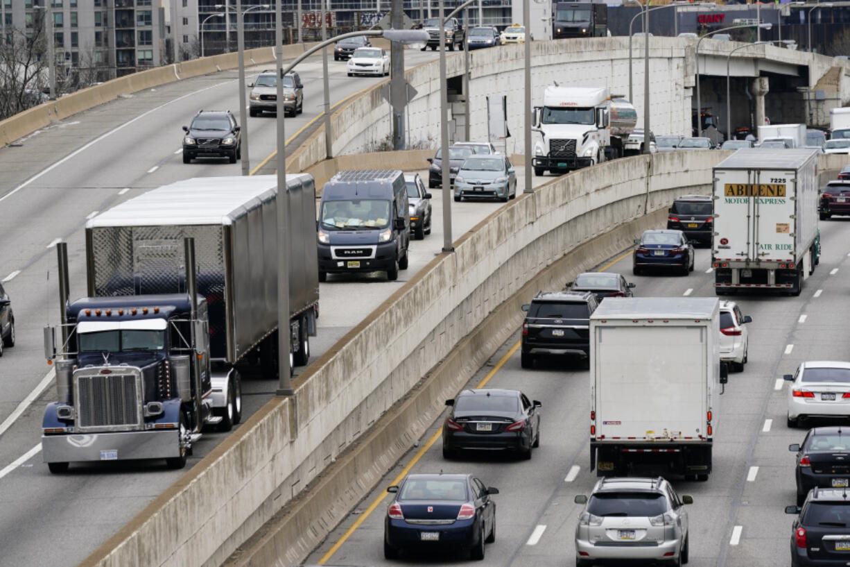FILE - Motor vehicle traffic moves along the Interstate 76 highway in Philadelphia, March 31, 2021. The EPA on Friday, March 29, 2024, set new greenhouse gas emissions standards for heavy-duty trucks, buses and other large vehicles, an action that officials said will clean up some of the nation&rsquo;s largest sources of planet-warming pollution.
