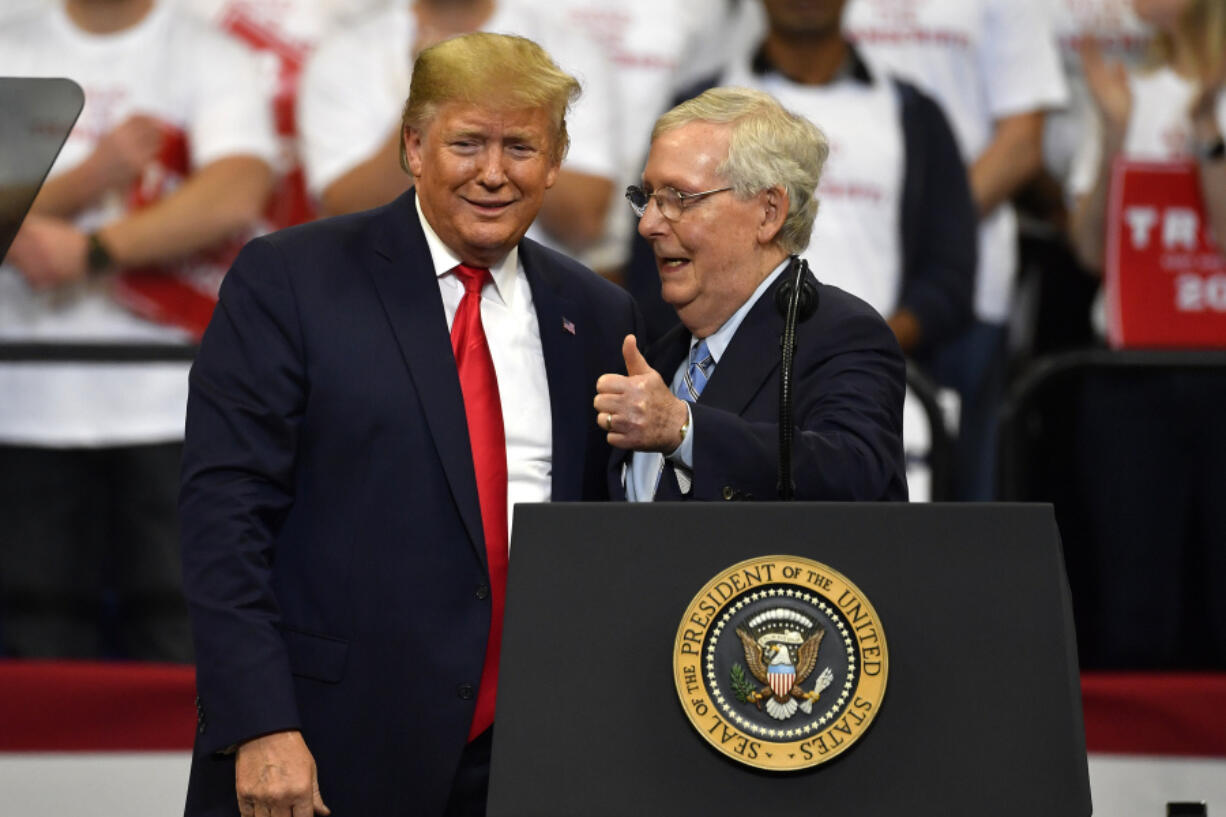 FILE - Then President Donald Trump, left, and Senate Majority Leader Mitch McConnell of Ky., greet each other during a campaign rally in Lexington, Ky., Nov. 4, 2019. McConnell has endorsed Donald Trump for president. McConnell announced his decision after Super Tuesday wins pushed Trump, who is the GOP front-runner, closer to the party nomination. It&rsquo;s a remarkable turnaround for McConnell, who has blamed Trump for &ldquo;disgraceful&rdquo; acts in the Jan. 6, 2021, attack on the Capitol. (AP Photo/Timothy D.