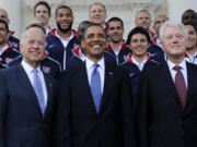 FILE - President Barack Obama, flanked by Vice President Joe Biden, left, and former President Bill Clinton, right, pose for a photo with the U.S. World Cup soccer team under the North Portico of the White House in Washington, May 27, 2010. President Joe Biden will share a stage with Barack Obama and Bill Clinton on Thursday in New York as he raises money for his reelection campaign. It&rsquo;s a one-of-a-kind political extravaganza that will showcase decades of Democratic leadership.