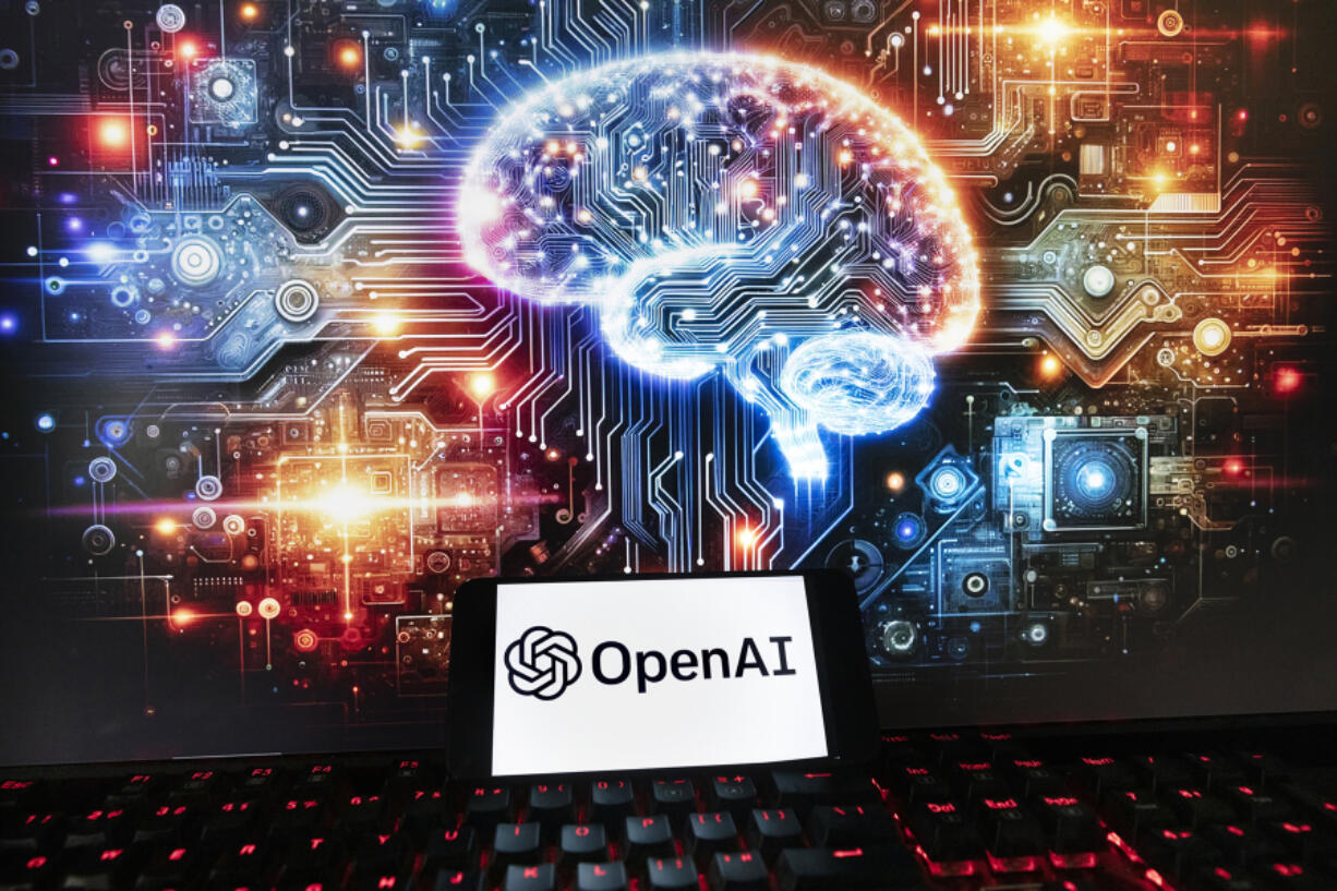 FILE - The OpenAI logo is displayed on a cell phone with an image on a computer monitor generated by ChatGPT&rsquo;s Dall-E text-to-image model, Friday, Dec. 8, 2023, in Boston. The maker of ChatGPT is now diving into the world of AI-generated video. Meet Sora &mdash; OpenAI&rsquo;s new text-to-video generator. The tool, which the San Francisco-based company unveiled on Thursday, Feb. 16, 2024 uses generative artificial intelligence to instantly create short videos based on written commands.