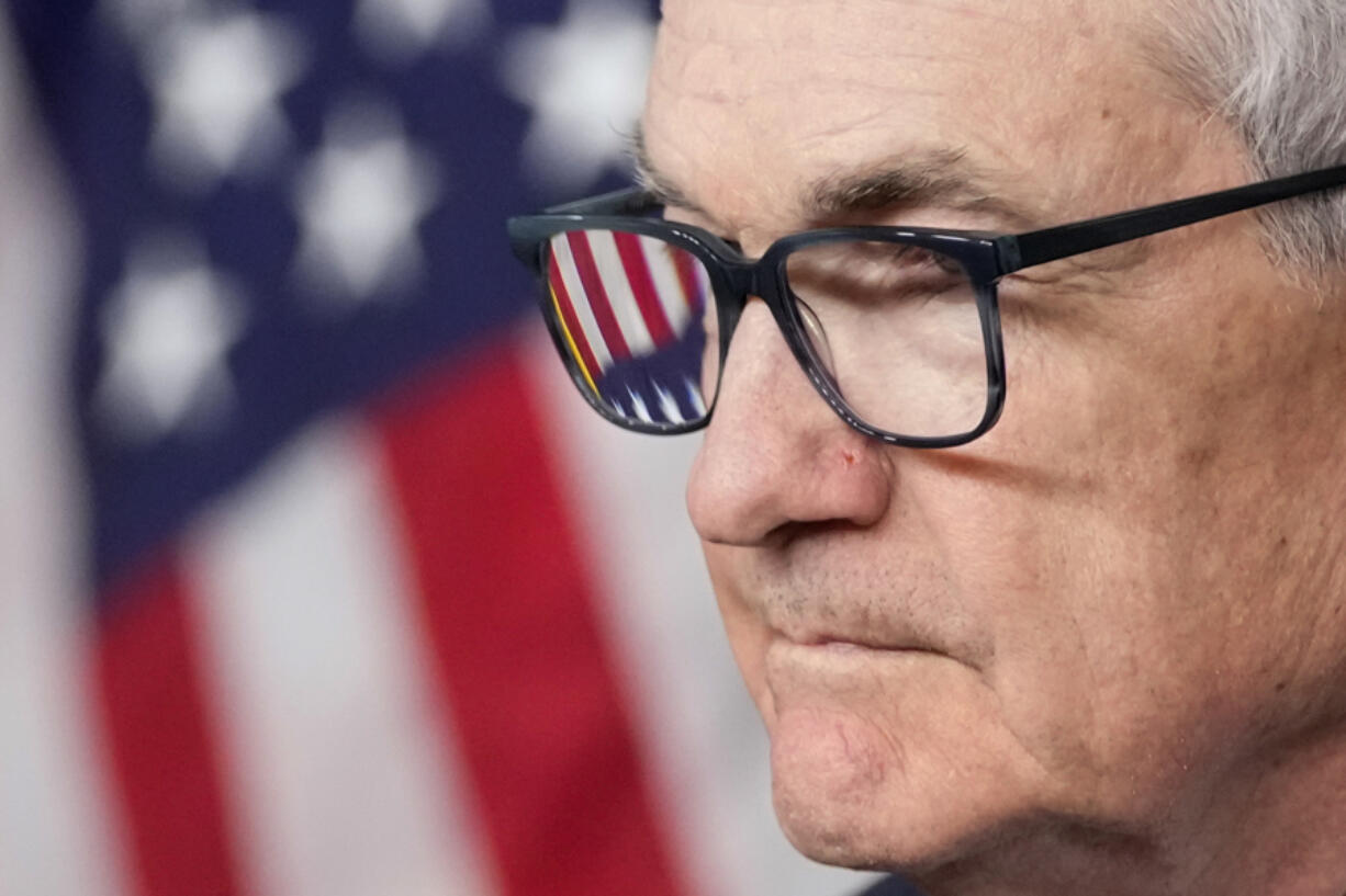FILE - An American flag is seen in Federal Reserve Board Chair Jerome Powell&rsquo;s glasses as he speaks at a news conference at the Federal Reserve, Dec. 13, 2023, in Washington. On Wednesday, March 6, 2024, Powell testifies to the House Financial Services Committee on the first of two days of semi-annual testimony to Congress.