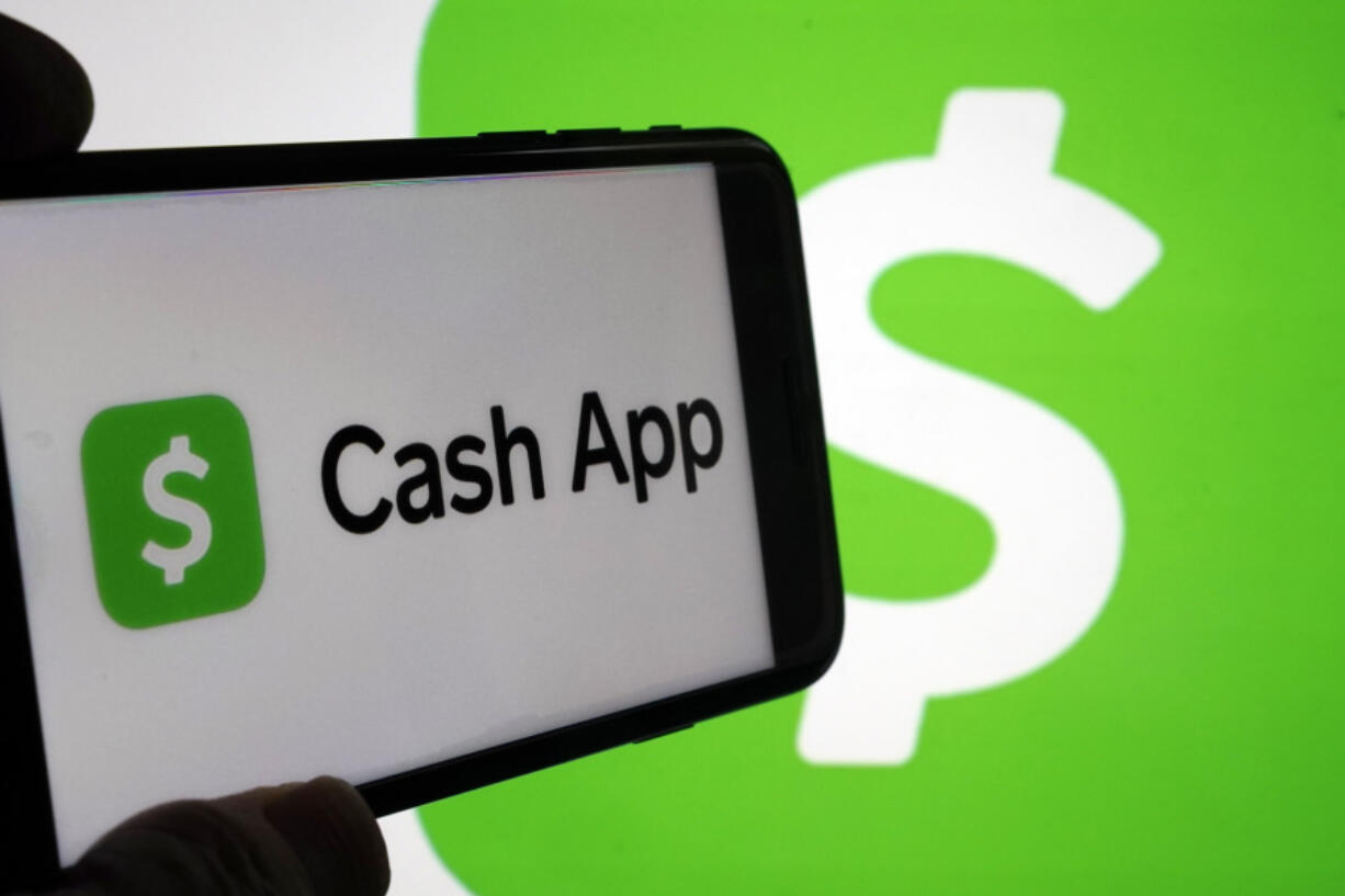 FILE - Logos for Cash App are shown on devices in New York, Sept. 8, 2023. Tax reporting requirements for freelancers or gig workers who receive payments via apps like Venmo, Zelle, Cash App or PayPal will change for the 2024 tax year.