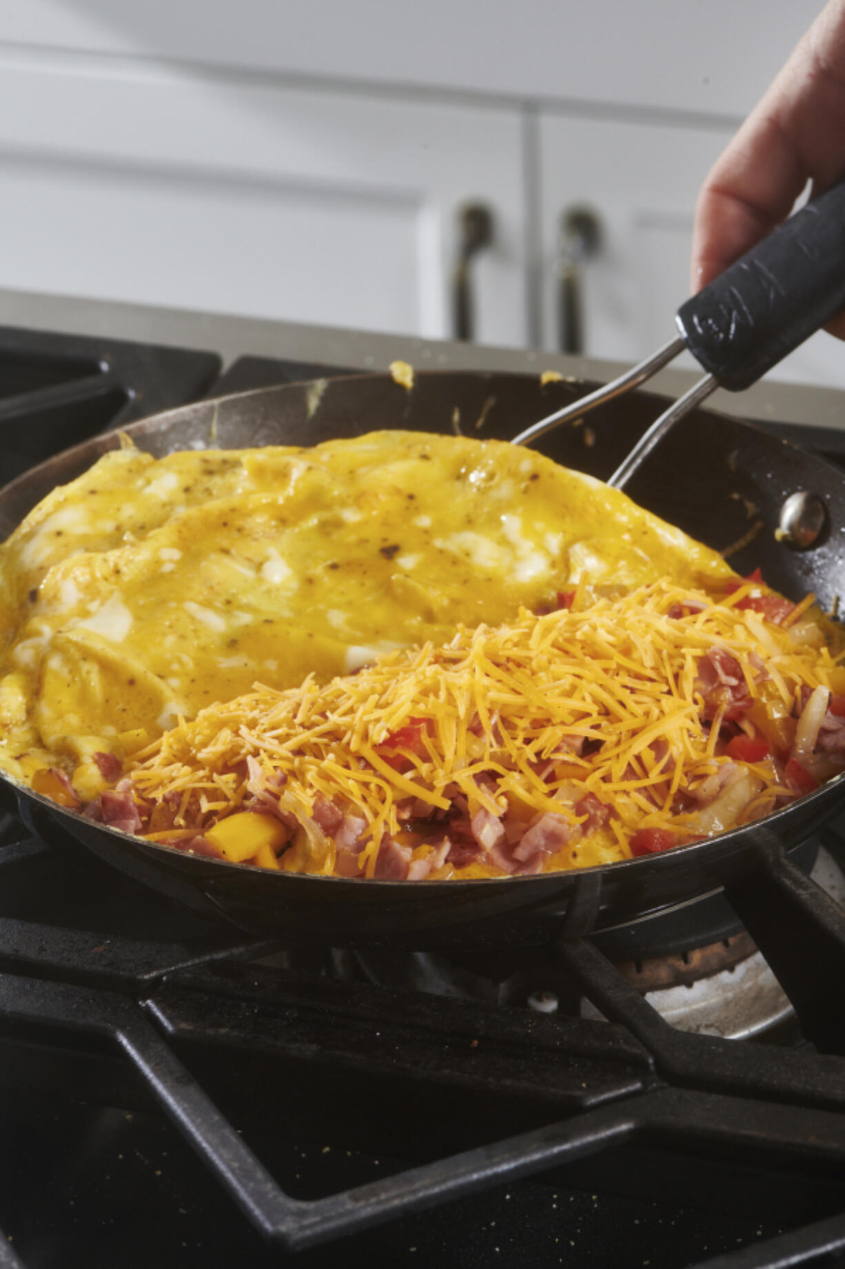 This image taken in 2021 shows Denver omelet being made in a skillet. Leftover Easter ham can be a springboard for other meals during the week. Of course you&rsquo;ll want a sandwich or two, but there are many other ways to put that porky, smoky flavor to good use, including omelettes.