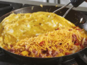 This image taken in 2021 shows Denver omelet being made in a skillet. Leftover Easter ham can be a springboard for other meals during the week. Of course you&rsquo;ll want a sandwich or two, but there are many other ways to put that porky, smoky flavor to good use, including omelettes.