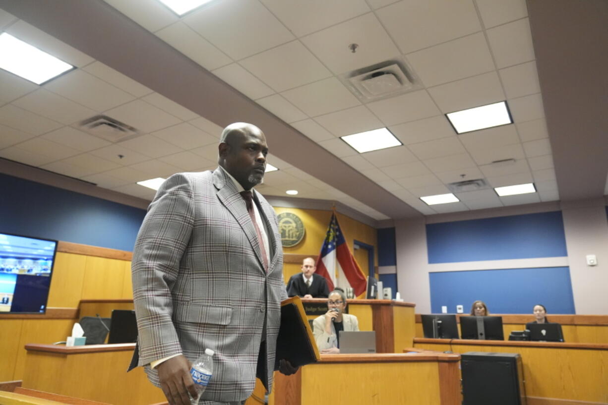 Terrence Bradley leaves the stand after testifying, Tuesday, Feb. 27, 2024, in Atlanta. Bradley, special prosecutor Nathan Wade&rsquo;s former law partner and onetime divorce attorney, testified as a judge considered an effort by lawyers for former President Donald Trump to disqualify Fulton County District Attorney Fani Willis over her romantic relationship with Wade.