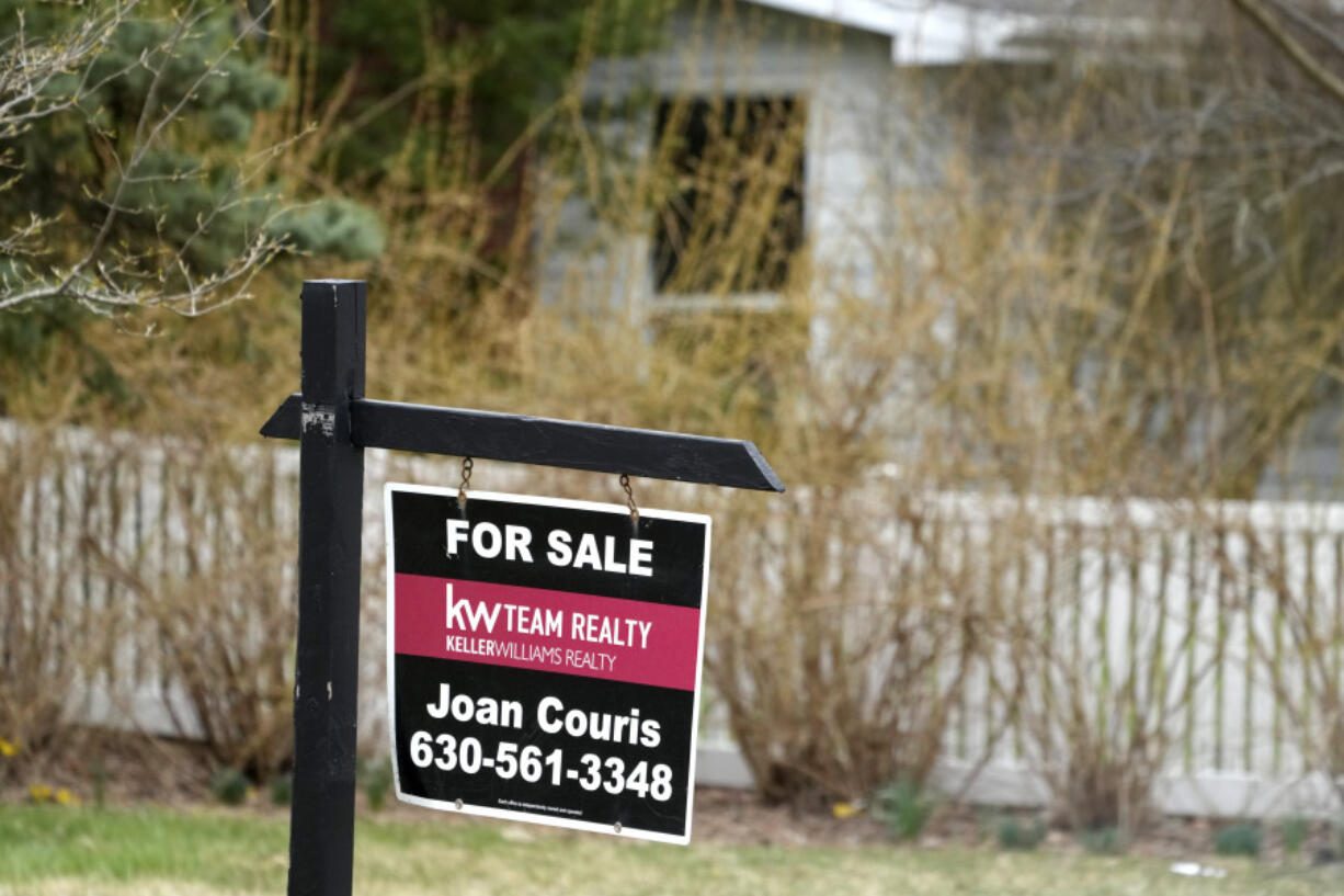 A &ldquo;for sale&rdquo; sign is displayed in front of a home in Mount Prospect, Ill., Monday, March 18, 2024. On Thursday, March 21, 2024, the National Association of Realtors reports on existing home sales for February. (AP Photo/Nam Y.