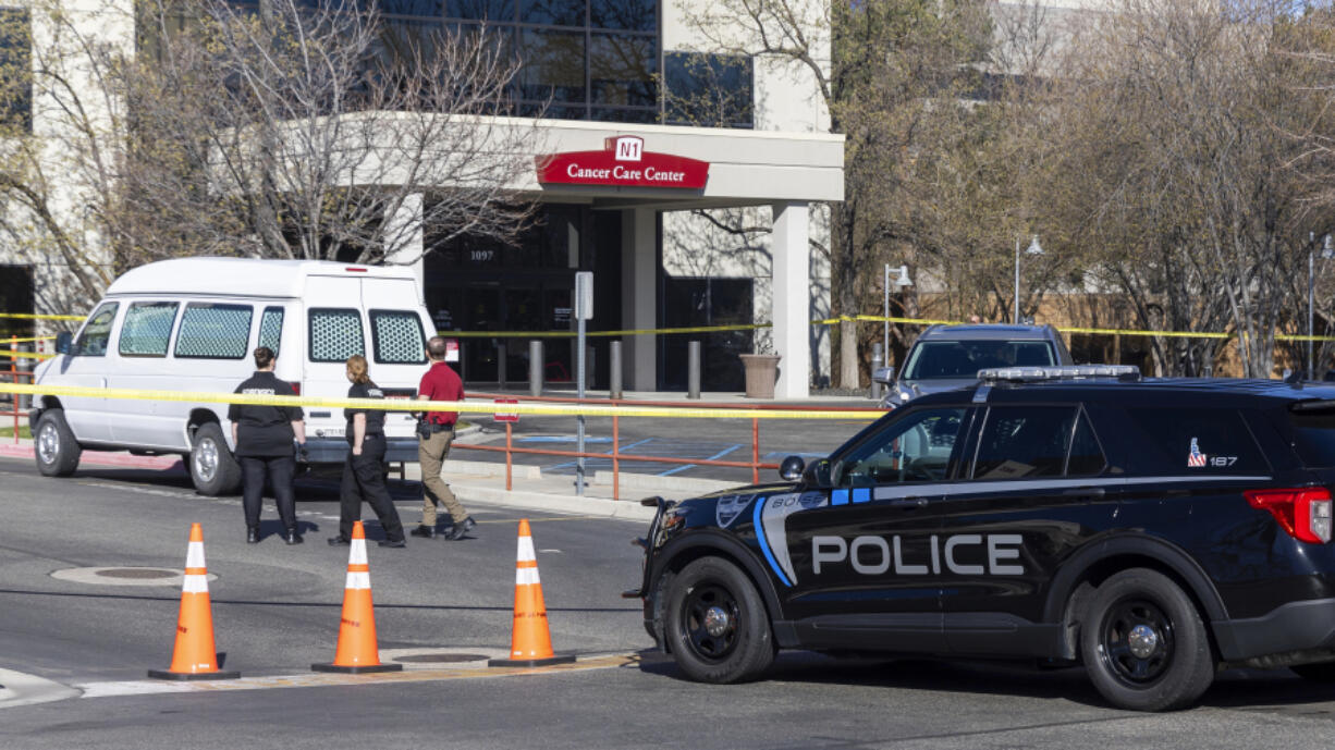 A police vehicle is parked outside Saint Alphonsus Regional Medical Center in Boise, Idaho, on Wednesday, March 20, 2024.   Three Idaho corrections officers were shot as a suspect staged a brazen attack to break Skylar Meade, a prison inmate out of the Boise hospital overnight. Two of the officers were shot by the suspect early Wednesday. The third was shot and wounded by a police officer when police mistook the correctional officer for the suspect.  (Sarah A.