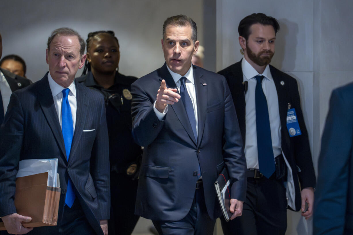 Hunter Biden, son of President Joe Biden, with attorney Abbe Lowell, left, leaves after a closed-door deposition in the Republican-led investigation into the Biden family, on Capitol Hill in Washington, Wednesday, Feb. 28, 2024. (AP Photo/J.