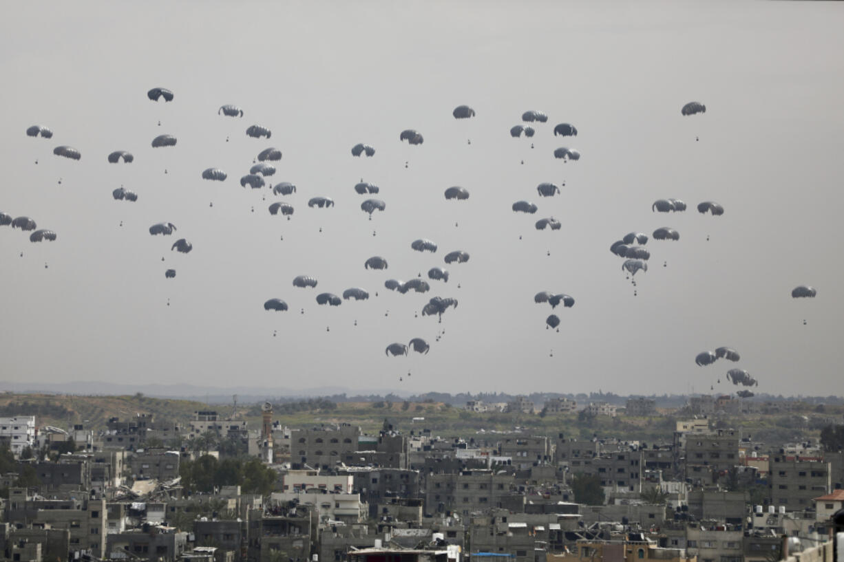 Humanitarian aid is airdropped to Palestinians in Gaza City, Gaza Strip, on Sunday, March 17, 2024.