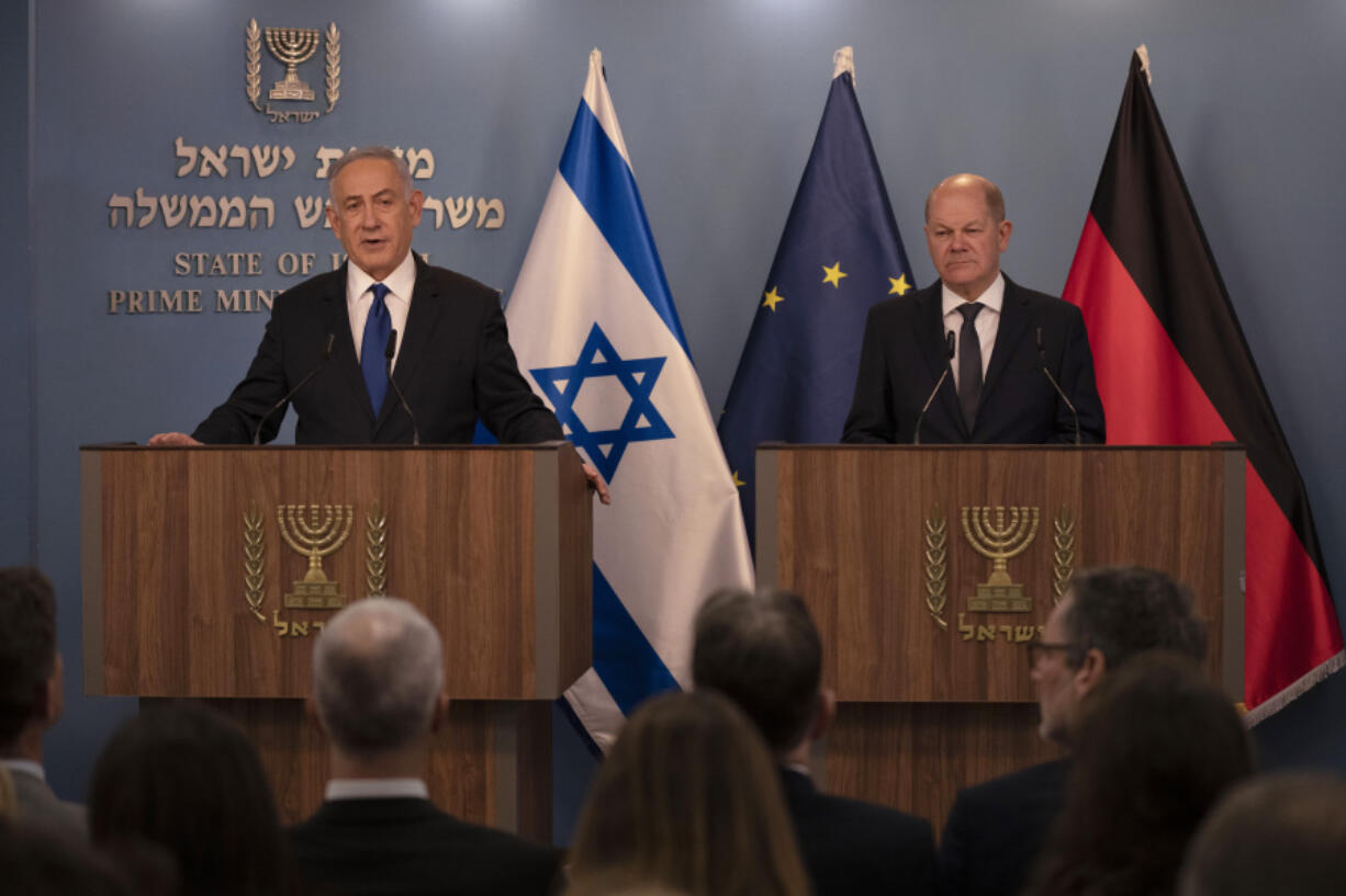Israeli Prime Minister Benjamin Netanyahu, left, delivers his speech after a meeting with German Chancellor Olaf Scholz in Jerusalem, Sunday, March 17, 2024.