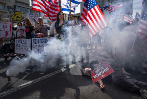 Israelis block a road as they demand the release of the hostages from Hamas captivity in the Gaza Strip, during a protest outside of the U.S. Embassy Branch Office in Tel Aviv, Israel, Friday, March 1, 2024.