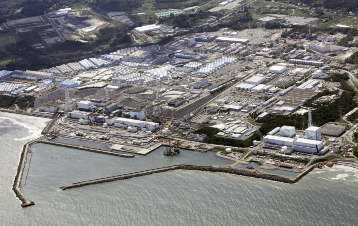 FILE - This aerial view shows the Fukushima Daiichi nuclear power plant, situated in coastal towns of both Okuma and Futaba, northeastern Japan, on Aug. 24, 2023, shortly after its operator Tokyo Electric Power Company Holdings TEPCO began releasing its first batch of treated radioactive water into the Pacific Ocean. Japan said Sunday, March 31, 2024, its experts have held talks with their Chinese counterparts to try to assuage Beijing&rsquo;s concerns over the discharge of treated radioactive wastewater from the wrecked Fukushima Daiichi nuclear power plant into the sea.