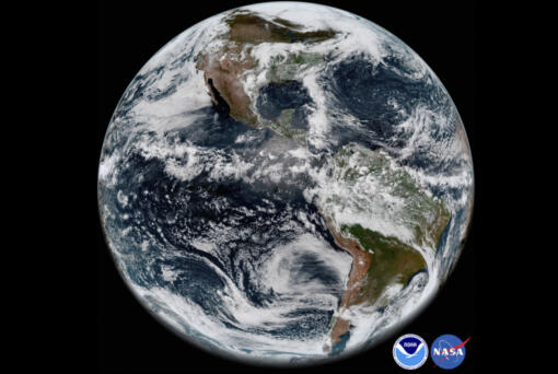 FILE - This image provided by NOAA/NASA In This May 31, 2018 satellite image shows the Earth&#039;s western hemisphere at 12:00 p.m. EDT on May 20, 2018, made by the new GOES-17 satellite, using the Advanced Baseline Imager (ABI) instrument. For the first time in history, world timekeepers may have to consider subtracting a second from our clocks in a few years because the planet is rotating a tad faster.