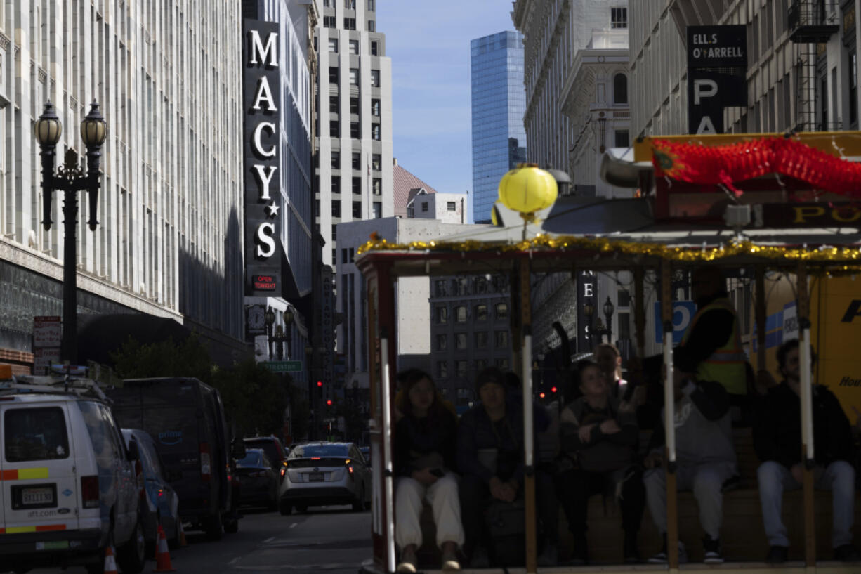 A cable car traveling along Powell Street passes Macy&rsquo;s near Union Square in San Francisco on Tuesday, Feb. 27, 2024. Macy&rsquo;s will close 150 unproductive namesake stores over the next three years, including 50 by year-end, the department store operator said Tuesday after posting a fourth-quarter loss and declining sales.