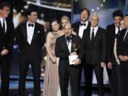 FILE - Matthew Weiner, creator of &ldquo;Mad Men,&rdquo; stands among cast and crew members as he accepts the award for best drama series at the 61st Primetime Emmy Awards in Los Angeles on Sept. 20, 2009. (AP Photos/Mark J.