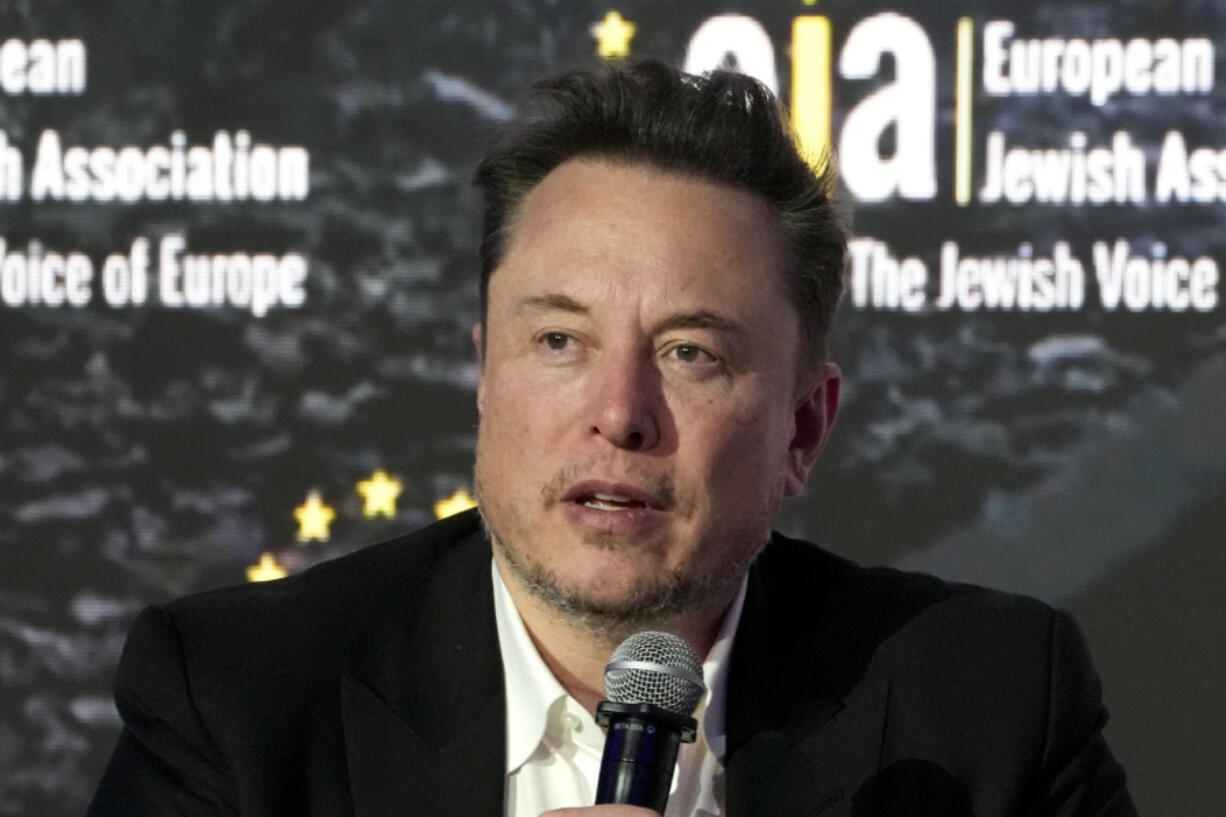 FILE -  Elon Musk addresses the European Jewish Association&rsquo;s conference, in Krakow, Poland, Monday, Jan. 22, 2024.  Musk is suing OpenAI and its CEO Sam Altman, Thursday, Feb. 29, over what he says is a betrayal of the ChatGPT maker&rsquo;s founding aims of benefiting humanity rather than pursuing profits.