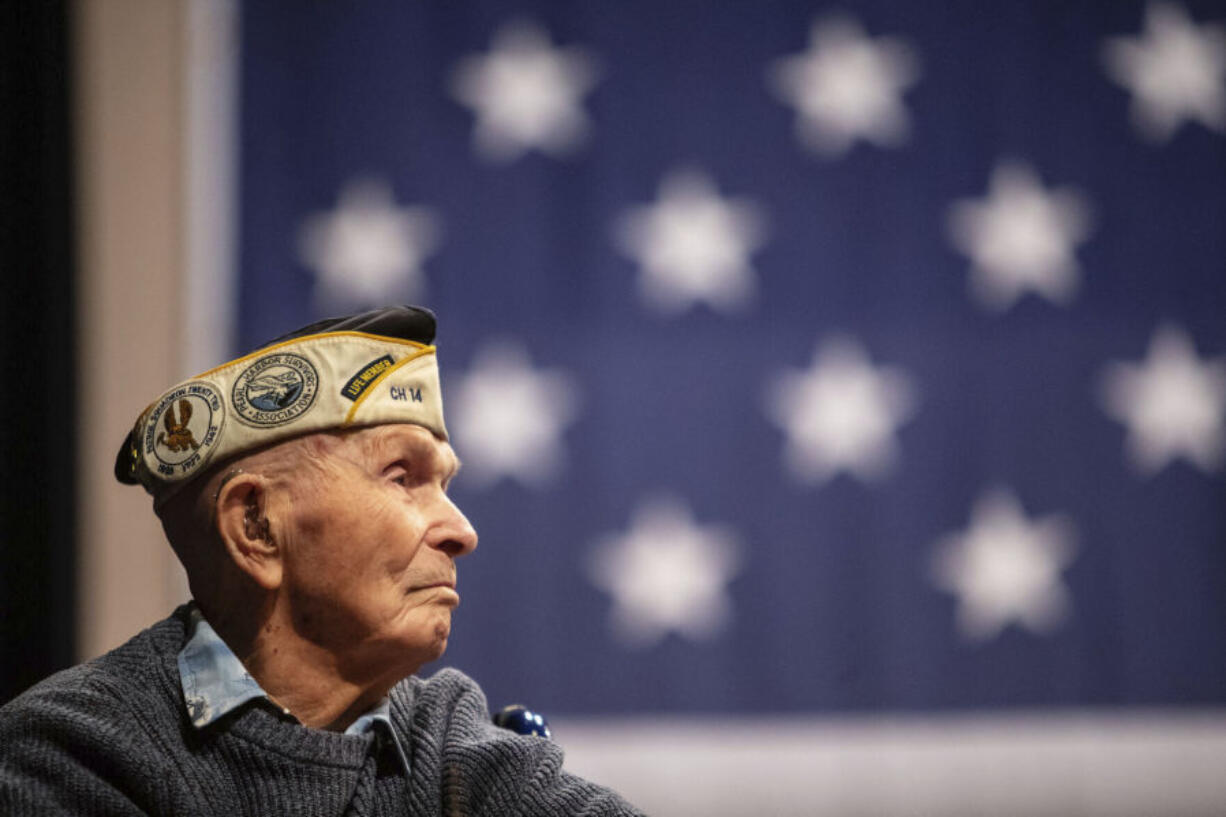Pearl Harbor survivor Dick Higgins listens to a speaker during a ceremony at Bend High School in Bend, Ore., on Dec. 7, 2023, to honor him as well as those who died in the Dec. 7, 1941 attack on Pearl Harbor.  Higgins, one of the few remaining survivors of the Japanese attack on Pearl Harbor, died Tuesday, March 19, 2024, at his home in Bend, Ore. He was 102.