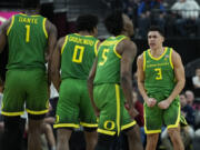 Oregon guard Jackson Shelstad (3) celebrates after a play against Arizona during the second half of an NCAA college basketball game in the semifinal round of the Pac-12 tournament Friday, March 15, 2024, in Las Vegas.
