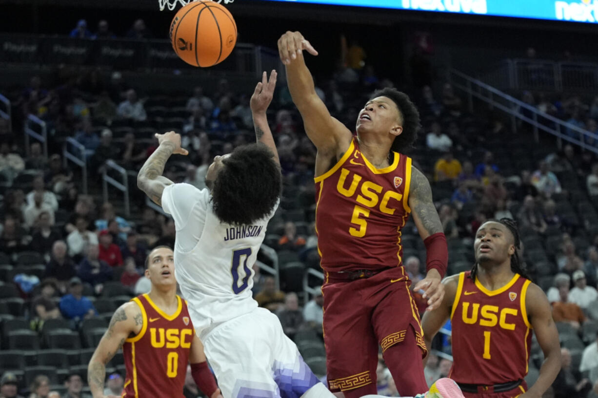 Southern California&#039;s Boogie Ellis (5) fouls Washington&#039;s Koren Johnson (0) during the second half of an NCAA college basketball game in the first round of the Pac-12 tournament Wednesday, March 13, 2024, in Las Vegas.