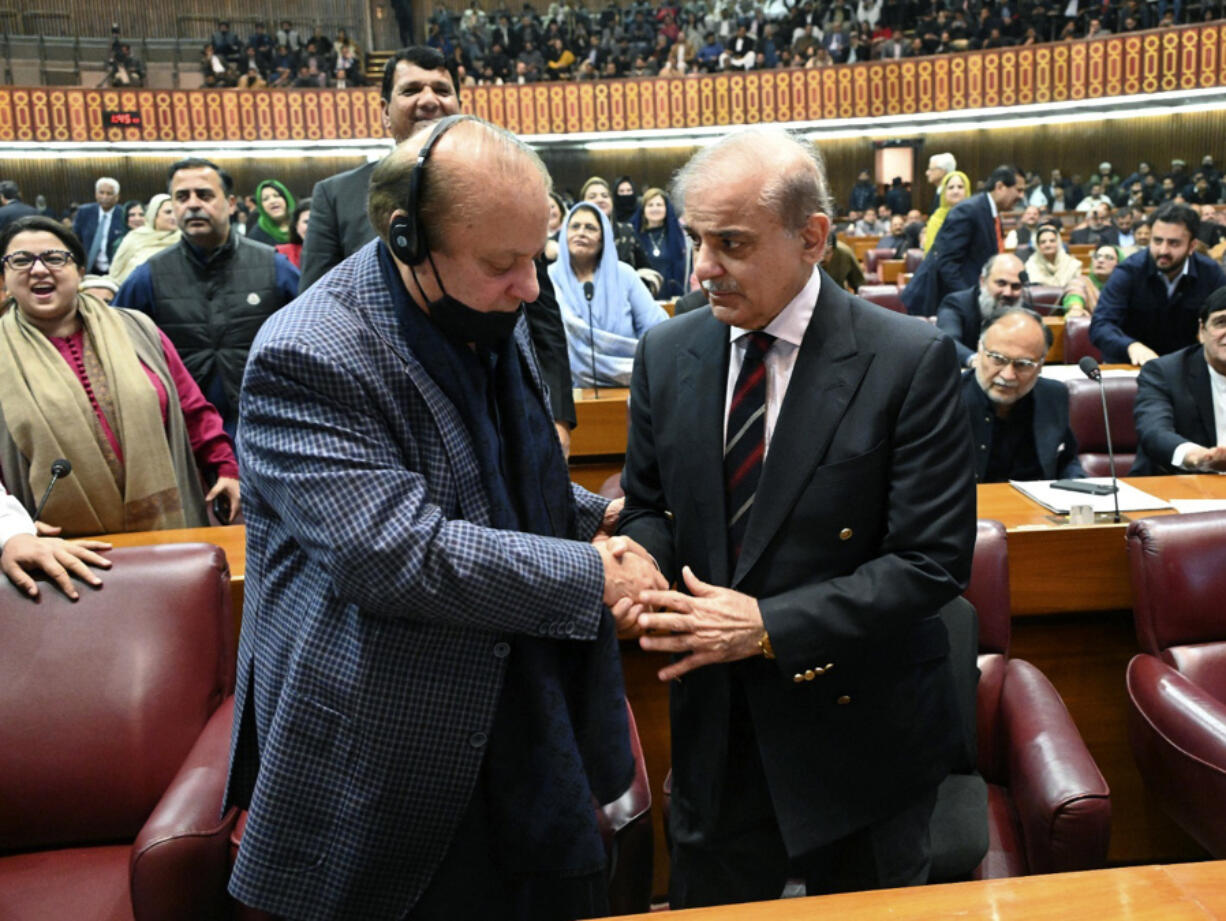 In this photo released by the National Assembly office, Pakistan&#039;s newly elected Prime Minister Shehbaz Sharif, foreground right, is congratulated by his elder brother and former Prime Minister Nawaz Sharif following his appointment, at a parliament session, in Islamabad, Pakistan, Sunday, March 3, 2024. Lawmakers in Pakistan&#039;s National Assembly elected Sunday Shehbaz Sharif as the country&#039;s new prime minister for the second time as allies of imprisoned former premier Imran Khan in parliament shouted in protest, alleging rigging in last month&#039;s election.