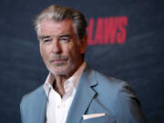 FILE - Pierce Brosnan, a cast member in &ldquo;The Out-Laws,&rdquo; poses at a special screening of the film, June 26, 2023, at the Regal LA Live theaters in Los Angeles. Brosnan, whose fictitious movie character James Bond has been in hot water plenty of times, pleaded guilty Thursday, March 14, 2024, to stepping out of bounds in a thermal area during a November 2023 visit to Yellowstone National Park.