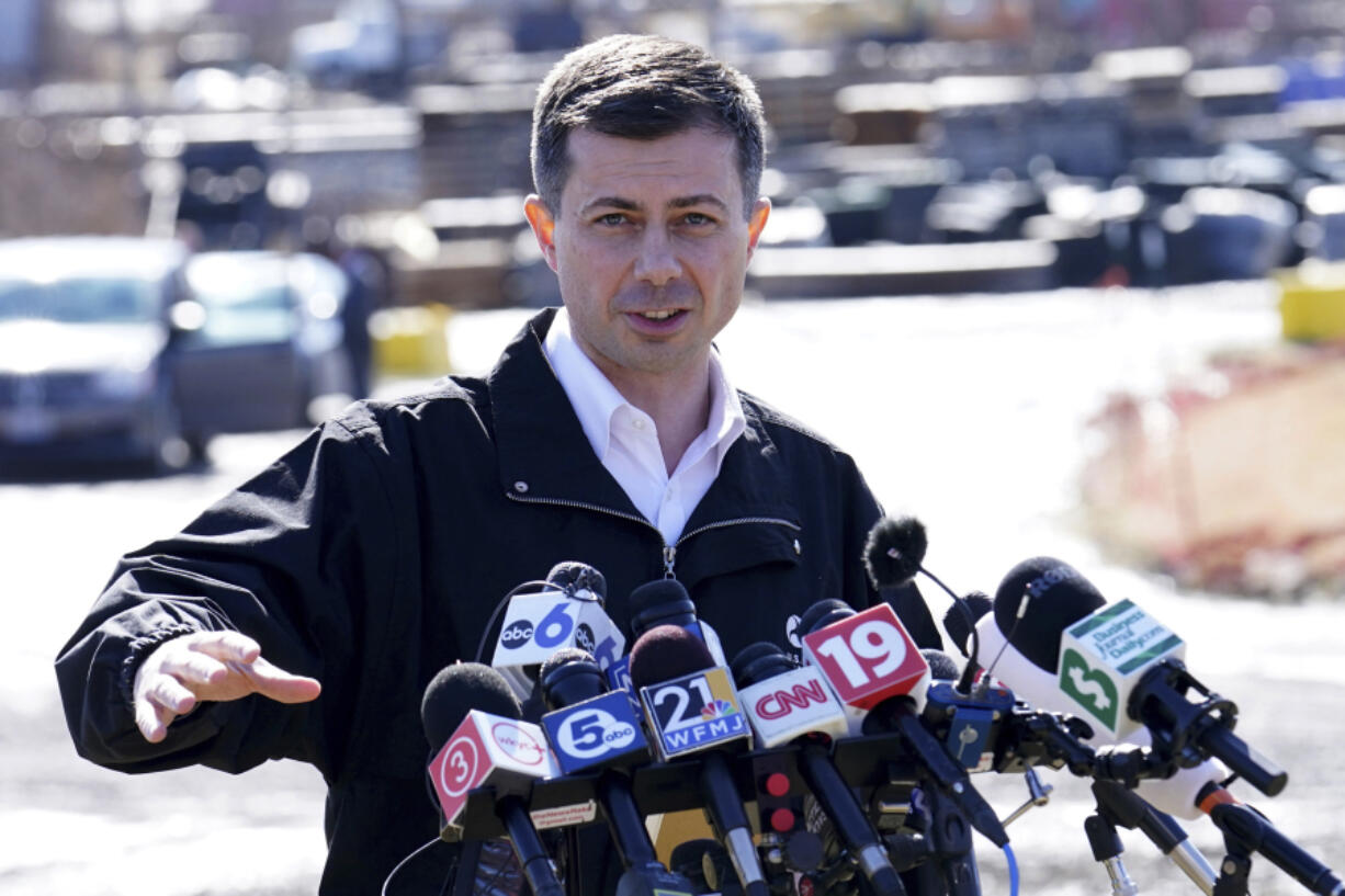 FILE - Transportation Secretary Pete Buttigieg speaks during a news conference near the site of the Feb. 3 Norfolk Southern train derailment in East Palestine, Ohio, Feb. 23, 2023. Buttigieg has reiterated his concerns about railroad safety and scolded the industry for not doing more to improve since last year&rsquo;s fiery Ohio derailment.