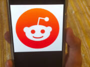 FILE - The Reddit logo is displayed on a mobile device in New York, June 29, 2020.  Reddit, that vast, lively and sometimes borderline shambolic repository of internet discussion, said Monday, March 11, 2024, that its pending initial public offering may be worth almost three quarters of a billion dollars.