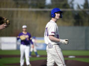 Ridgefield's Landon DeBeaumont looks back toward the stands after fouling off a pitch against Columbia River during a 2A GSHL baseball game on Friday, March 29, 2024, at Ridgefield Outdoor Recreation Complex.