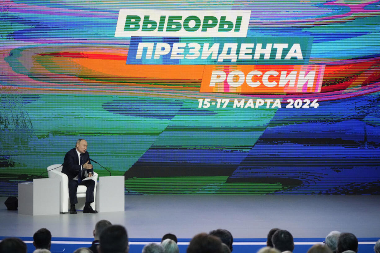 FILE - Russian President Vladimir Putin attends a meeting with his election campaign activists in Moscow, Russia, Wednesday, Jan. 31, 2024. Voting will largely be carried out in Russia at polling stations over three days between March 15-17.