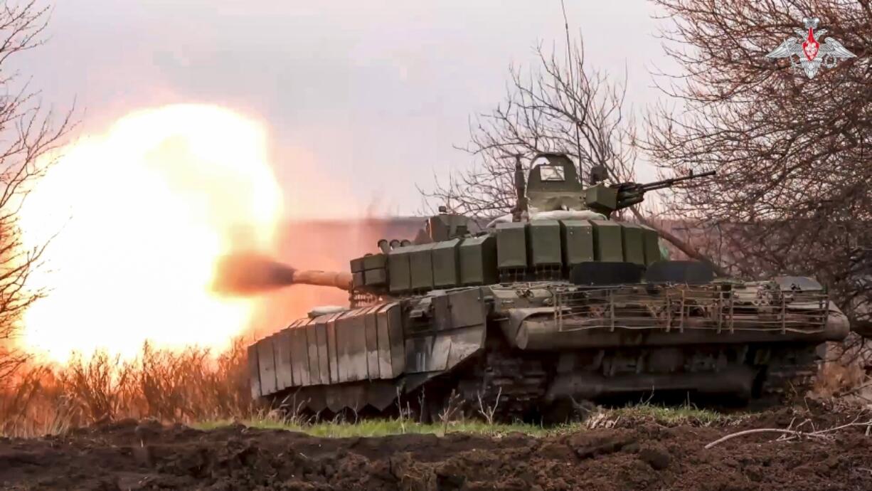 In this photo released by the Russian Defense Ministry Press Service on Tuesday, March 19, 2024, a Russian tank fires its cannon at Ukrainian troops from a position near the border with Ukraine in the Belgorod region, Russia. Ukrainian forces have launched repeated cross-border attacks on Russia&rsquo;s Belgorod region.