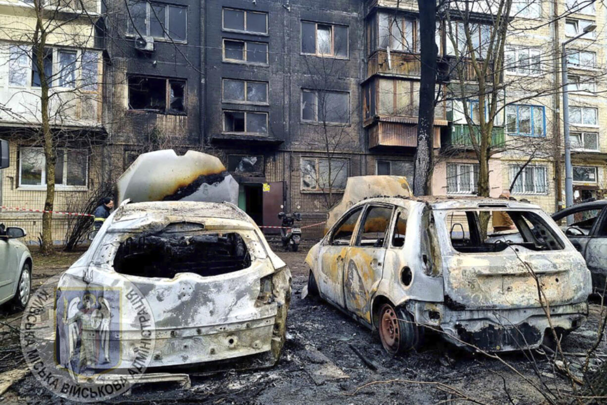 In this photo provided by Serhii Popko, the head of the city&rsquo;s military administration, burned car are seen at the site after Russian attacks in Kyiv, Ukraine, Thursday, March 21, 2024. Around 30 cruise and ballistic missiles were shot down over Kyiv on Thursday morning, according Serhii Popko. The missiles were entering Kyiv simultaneously from various directions in a first missile attack on the capital in 44 days.