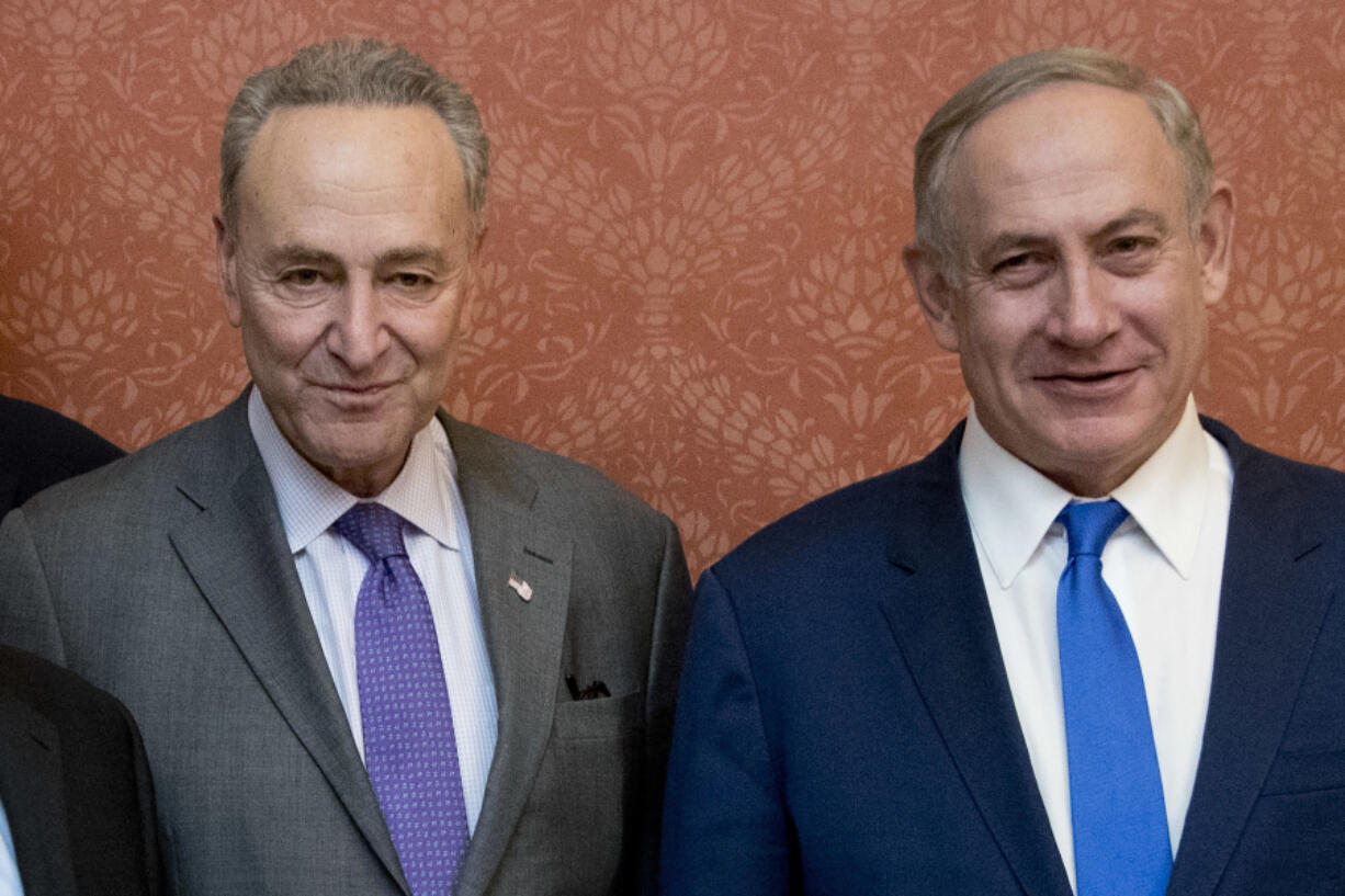 FILE - Israeli Prime Minister Benjamin Netanyahu, right, poses for a picture with Senate Minority Leader Chuck Schumer of New York, on Capitol Hill in Washington, Feb. 15, 2017. Schumer is calling on Israel to hold new elections. Schumer says he believes Israeli Prime Minister Benjamin Netanyahu has &ldquo;lost his way&rdquo; amid the Israeli bombardment of Gaza and a growing humanitarian crisis there. Schumer is the first Jewish majority leader in the Senate and the highest-ranking Jewish official in the U.S..