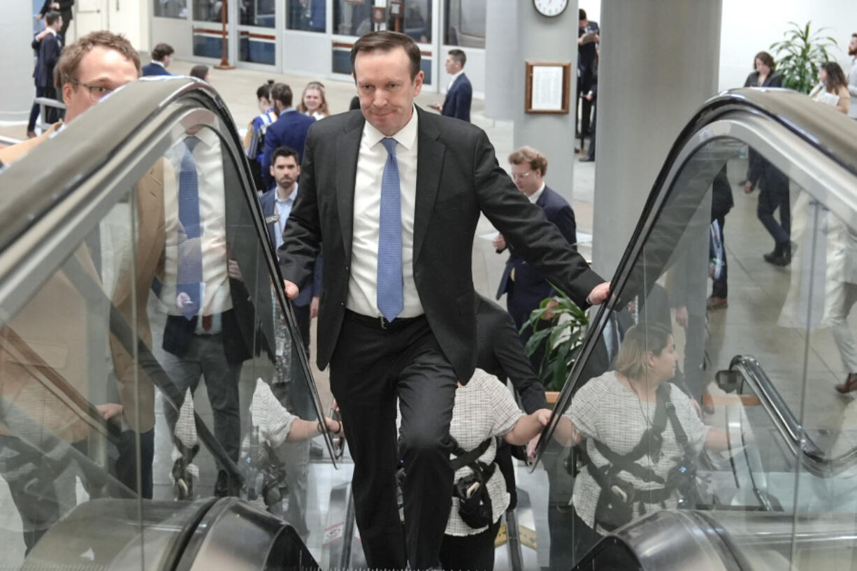 Sen. Chris Murphy, D-Conn., rides an escalator at the Senate subway on Capitol Hill Tuesday, March 12, 2024, in Washington.