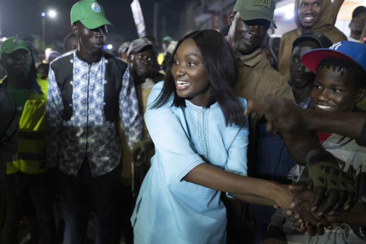 Presidential candidate Anta Babacar Ngom greets supporters during her electoral campaign caravan in Dakar, Senegal, Monday, March 11, 2024. Senegal&rsquo;s only female presidential candidate may stand no chance of winning but activists say her presence alone is helping to advance a decades long campaign to achieve equality in the West African nation.