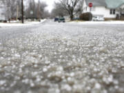 FILE - Hail stones cover the streets, Jan. 20, 2010, in Kirksville, Mo. Volatile weather is expected to hone in on parts of Kansas and Missouri on Wednesday night, March 13, 2024, and the biggest worry is the potential for massive chunks of hail.