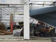 A damaged storage unit is visible following a severe storm Friday, March 15, 2024, in Lakeview, Ohio. (AP Photo/Joshua A.