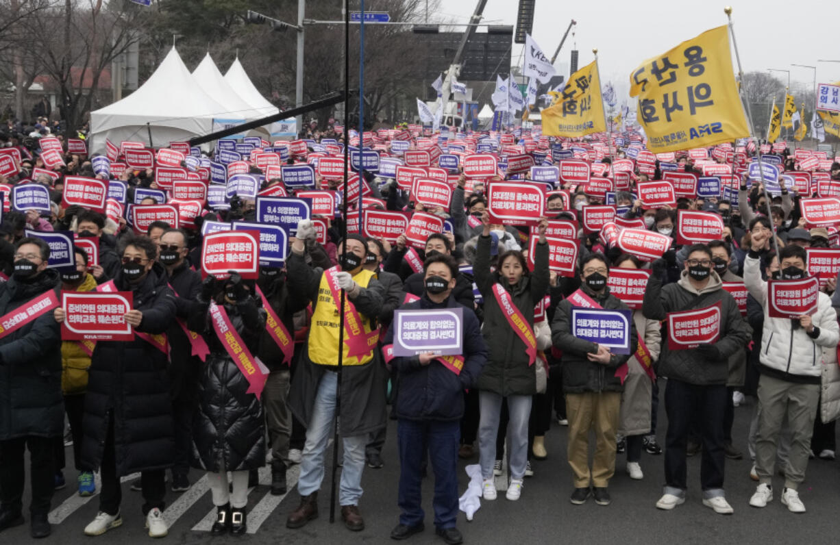 Doctors stage a rally against the government&#039;s medical policy in Seoul, South Korea, Sunday, March 3, 2024. Thousands of senior doctors rallied in Seoul on Sunday to express their support for junior doctors who have been on strike for nearly two weeks over a government plan to sharply increase the number of medical school admissions.