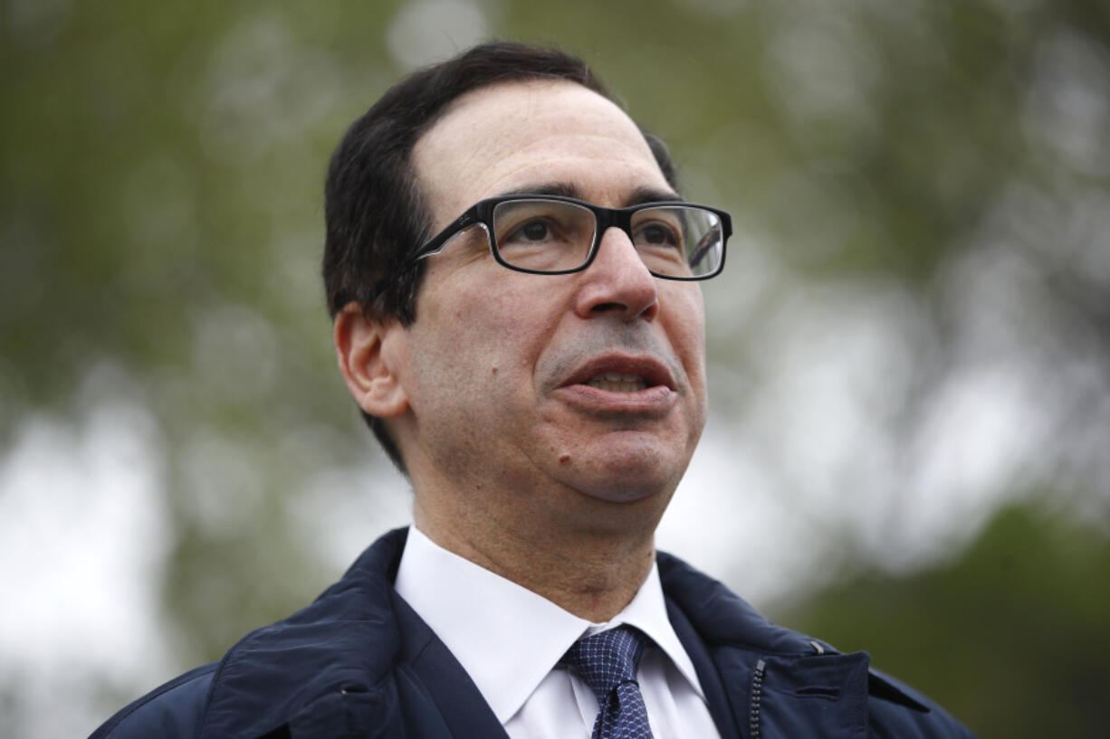 FILE - Former Treasury Secretary Steve Mnuchin speaks with reporters outside the White House, March 29, 2020, in Washington. Mnuchin says he&rsquo;s going to put together an investor group to buy TikTok, a day after the House of Representatives passed a bill that would ban the popular video app in the U.S.