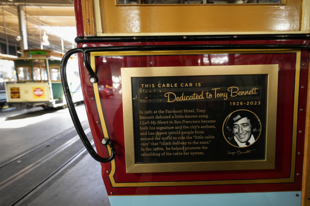A commemorative plaque is seen on a cable car dedicated to Tony Bennett in San Francisco, Thursday, March 14, 2024. Tony Bennett loved San Francisco and its cable cars and in return, the city has dedicated one of those cable cars to the famous crooner who died in July. Cable car 53, built in 1907, has several plaques and painted gold ribbons remembering Bennett.