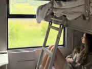 Sarah Marks of London looks out at the Italian countryside June 10 on TrenItalia&rsquo;s Intercity Notte sleeper train from Palermo to Rome.