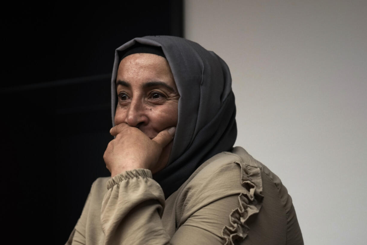 Cigdem Kuzey, sister of Muhterem Evcil, looks on during an interview with the Associated Press in Istanbul, Turkey, Wednesday, March 6, 2024. Muhterem Evcil was stabbed to death by her estranged husband at her workplace in Istanbul, where he had repeatedly harassed her in breach of a restraining order. More than a decade later, her sister believes Evcil would still be alive if authorities had enforced laws on protecting women and jailed him.